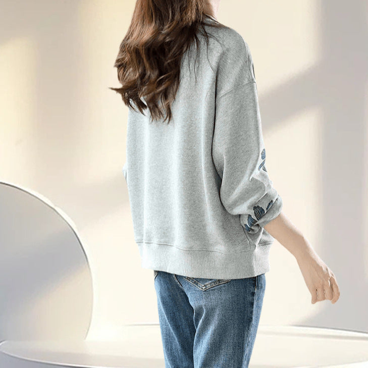 A flower beaded sweater