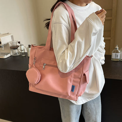 A new solid color canvas bag women's large-capacity shoulder bag student versatile tote bag hand bag messenger cloth bag