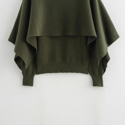 A cape knitted sweater