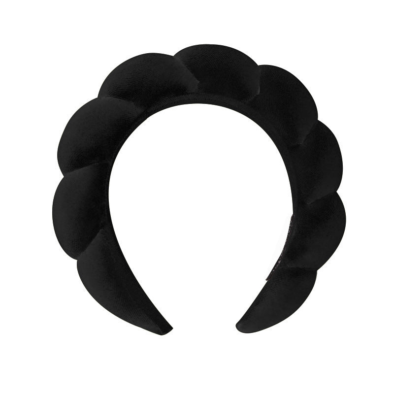 A towel fleece sponge twist headband
