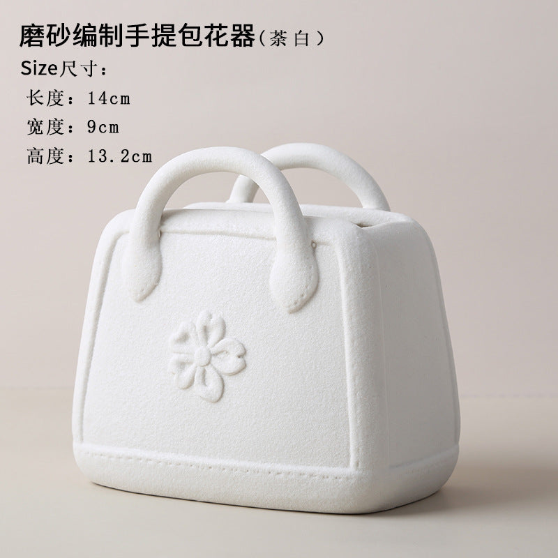 A ceramic handbag vase ornament