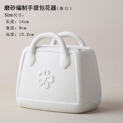 A ceramic handbag vase ornament