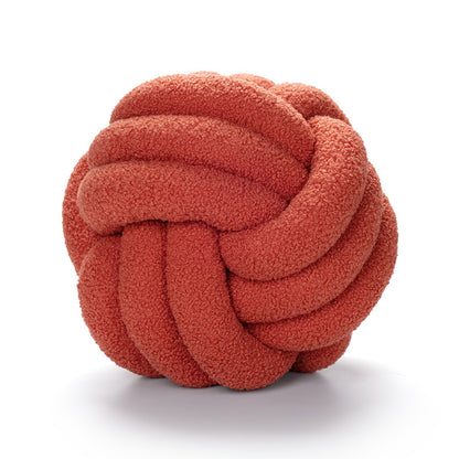 A braided knotted ball pillow