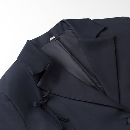 A bow-embellished blazer