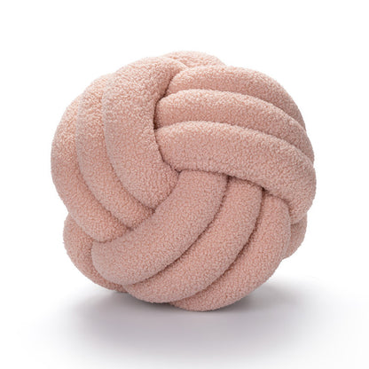 A braided knotted ball pillow