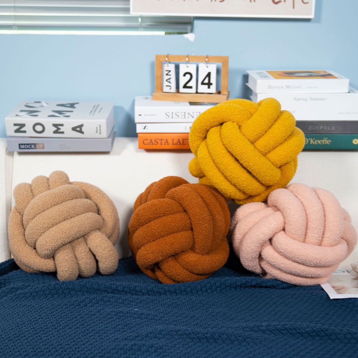 A braided knotted ball pillow