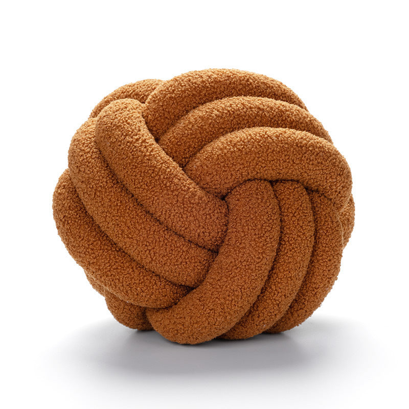 A braided knotted ball pillow