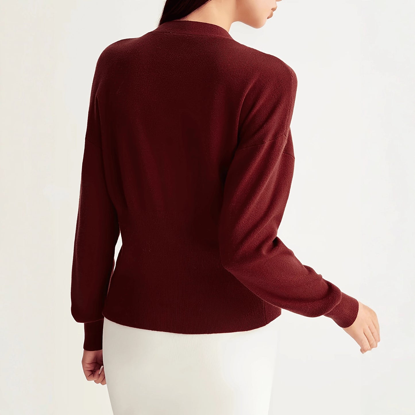 A button-down V-neck knitted sweater