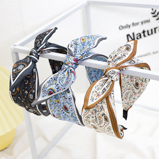 A Korean version of the new product headband fashion calico geometric wide edge headgear hair bundle go out bow hairpin