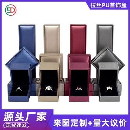 A brushed PU leather bronzing LOGO jewelry box