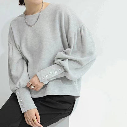 A casual top with long sleeves