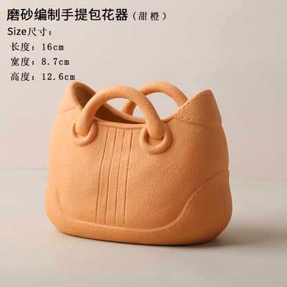 A ceramic handbag vase ornament