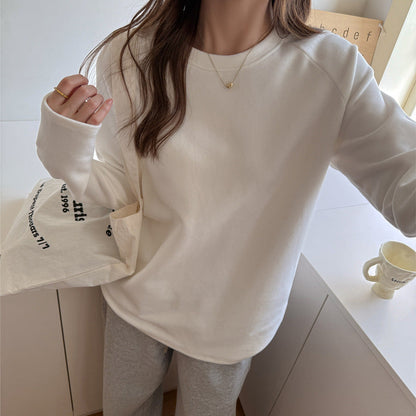 A crewneck long-sleeved top