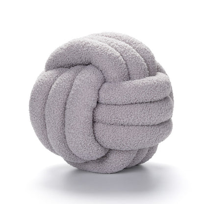 A braided knotted ball pillow