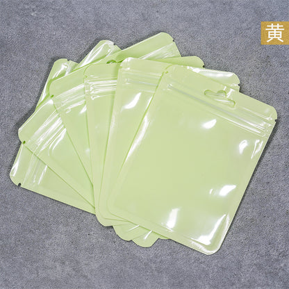 A Macaron color self-sealing bag, holographic bag, thickened transparent color bone bag, jewelry, sealed pocket, makeup brush, packaging bag.