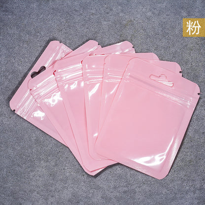A Macaron color self-sealing bag, holographic bag, thickened transparent color bone bag, jewelry, sealed pocket, makeup brush, packaging bag.