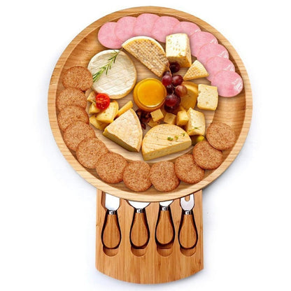 A bamboo and wood cheese board cheese board wooden round rotatable cutting board with drawer small bowl knife and fork set