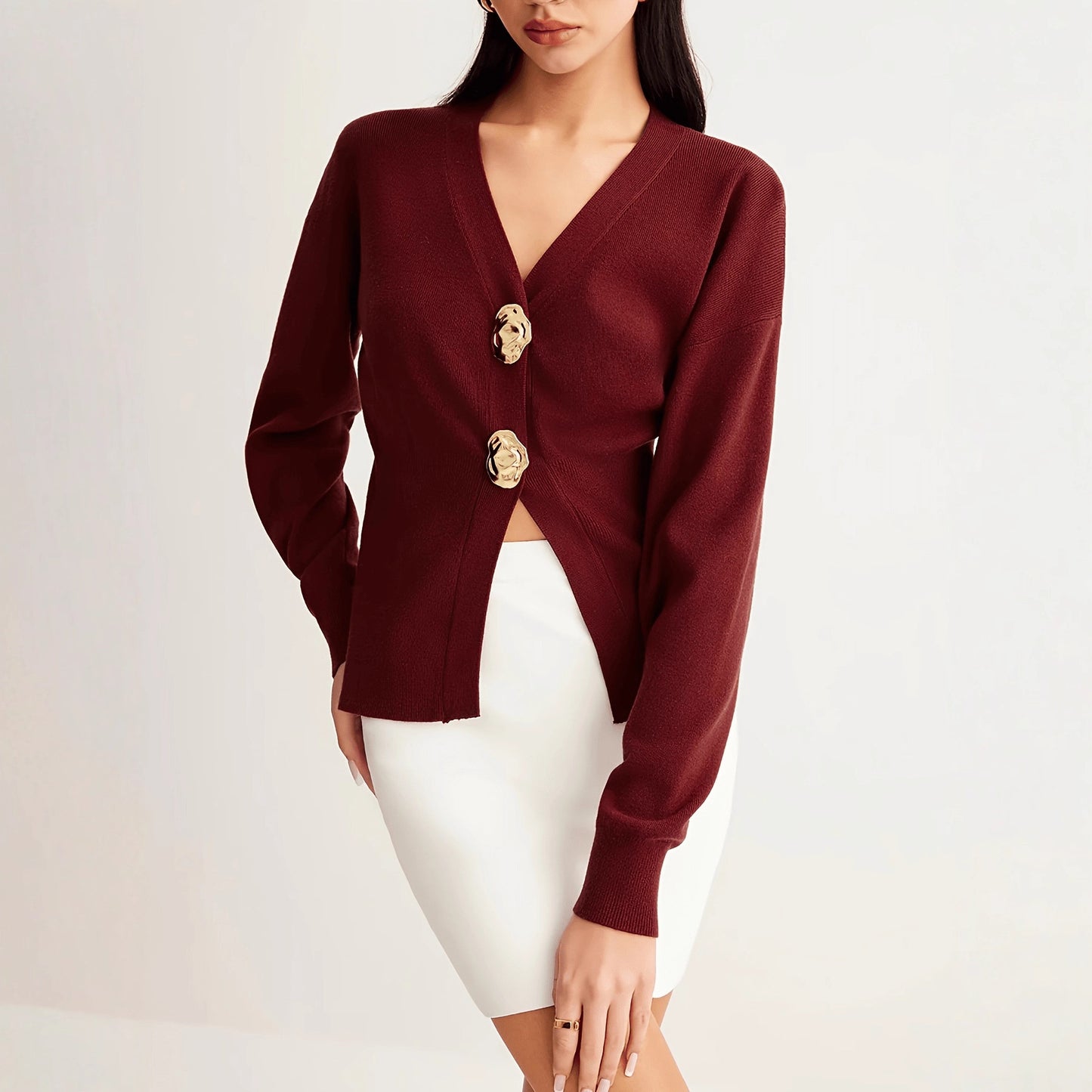 A button-down V-neck knitted sweater