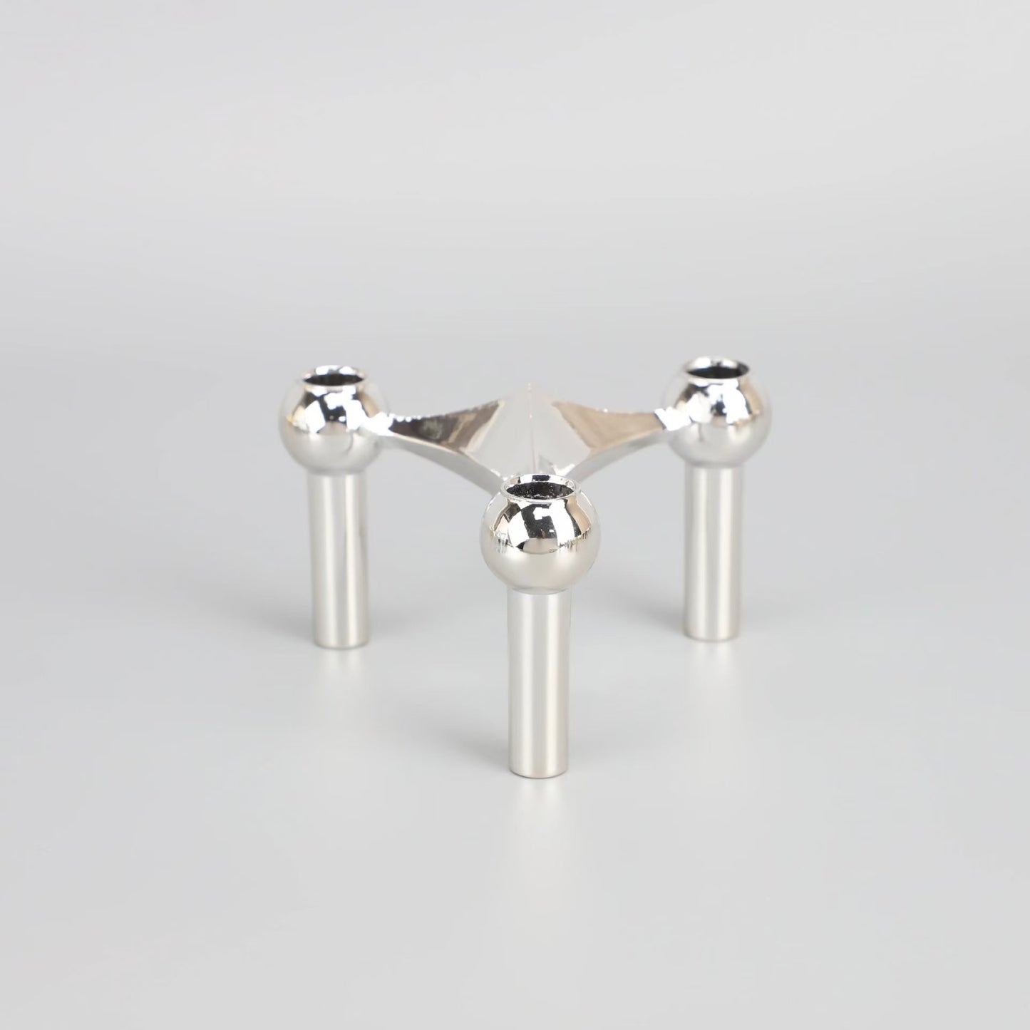 A tripod candlestick alloy decorative ornament