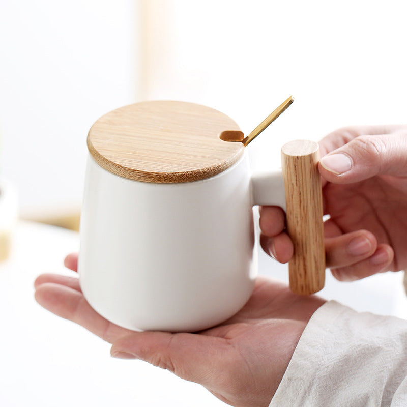 A wooden handle ceramic water cup