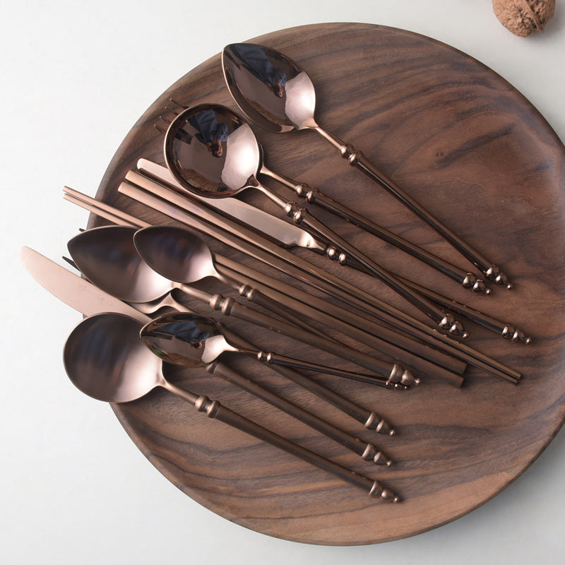 A stainless steel knife and fork set