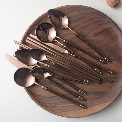 A stainless steel knife and fork set