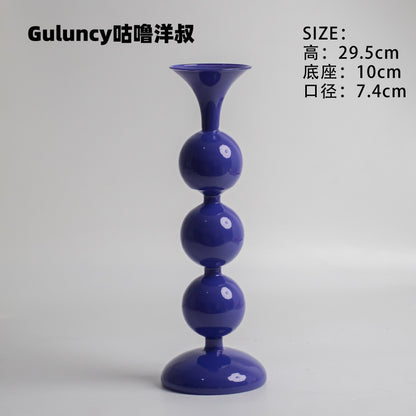 A vintage French Roman column glass candle holder