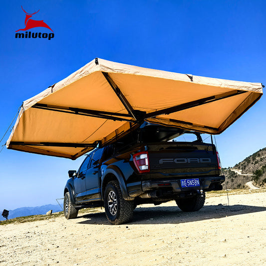 A double pole scalloped roof tent with lights