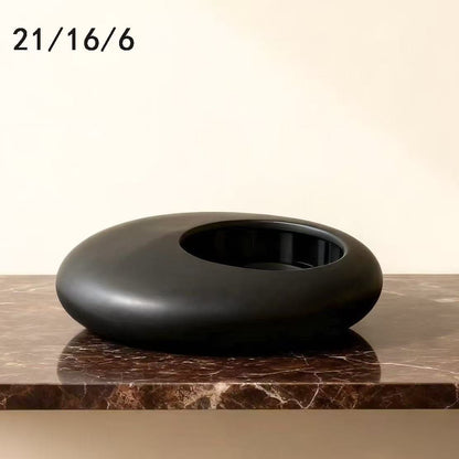 A ceramic flower pot potting container