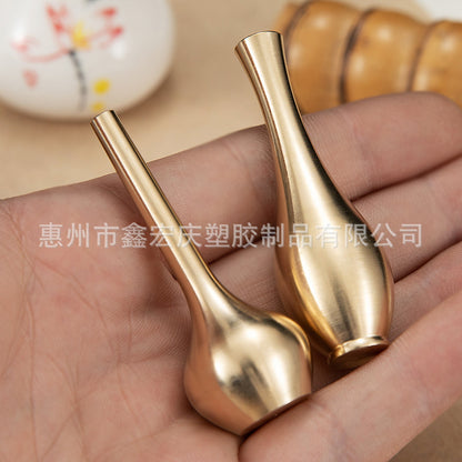 A brass mini vase ornament