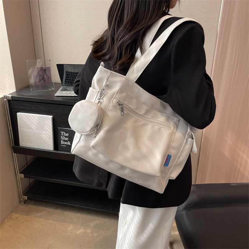 A new solid color canvas bag women's large-capacity shoulder bag student versatile tote bag hand bag messenger cloth bag