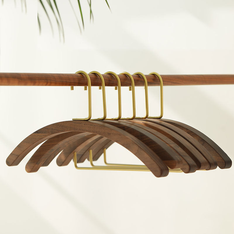 A semi-circular black walnut solid wood hanger
