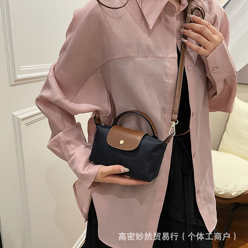 A new Oxford cloth women's bag fashion splicing dumpling bag simple handbag premium texture commuter bag