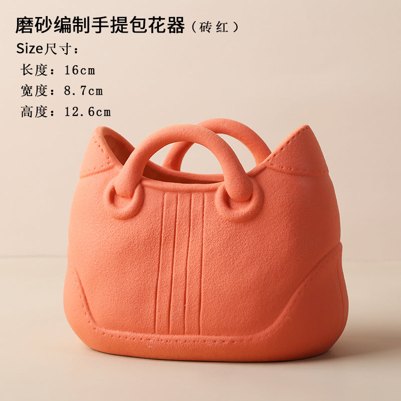 A ceramic handbag vase ornament