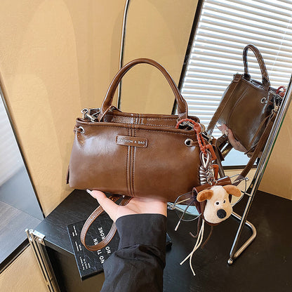 A handbag messenger bag
