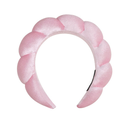 A towel fleece sponge twist headband