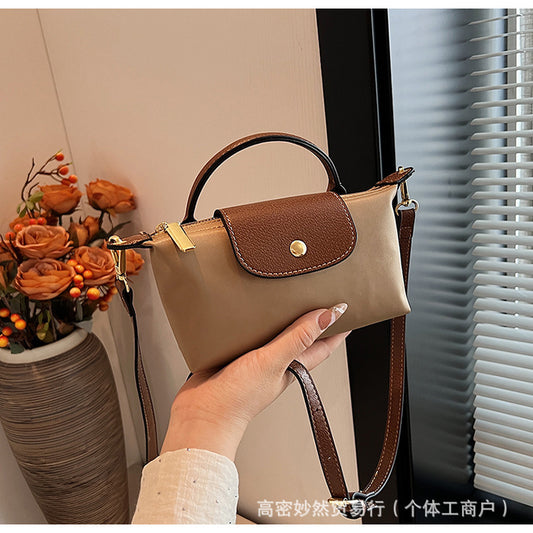 A new Oxford cloth women's bag fashion splicing dumpling bag simple handbag premium texture commuter bag