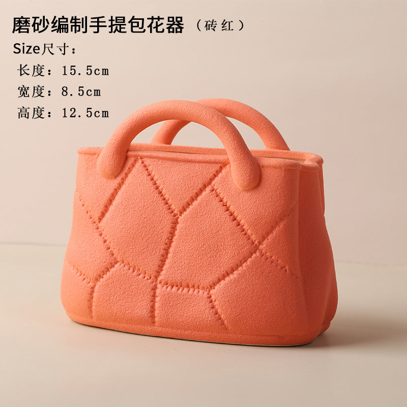 A ceramic handbag vase ornament