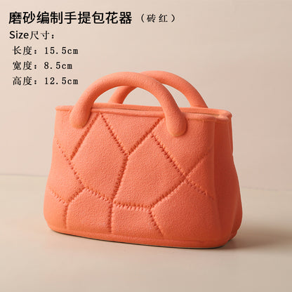 A ceramic handbag vase ornament