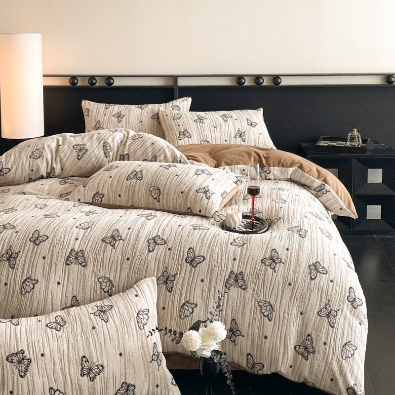 A four-piece quilt cover on the bed