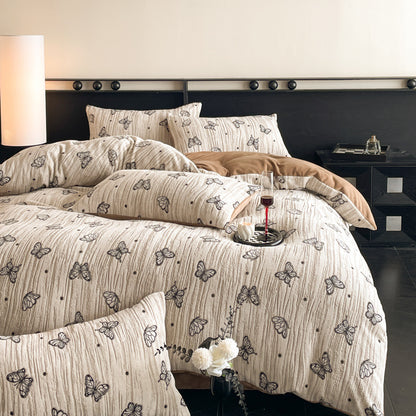 A four-piece quilt cover on the bed