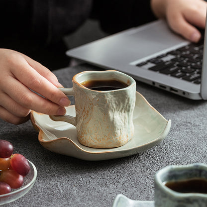 A ceramic coffee cup and saucer set