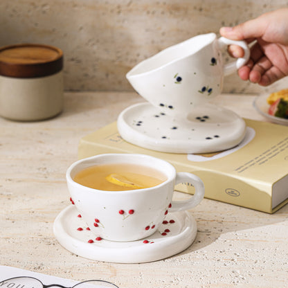 A Embossed Ceramic Coffee Cup and Saucer Set