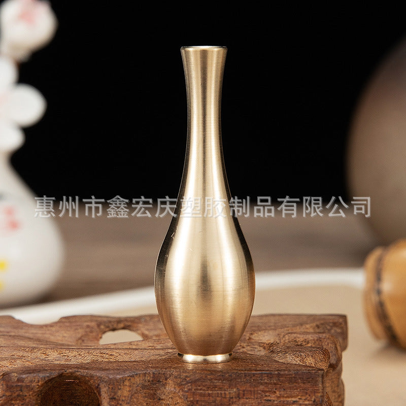A brass mini vase ornament