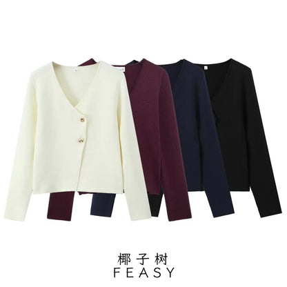 A button-down long-sleeved knit top