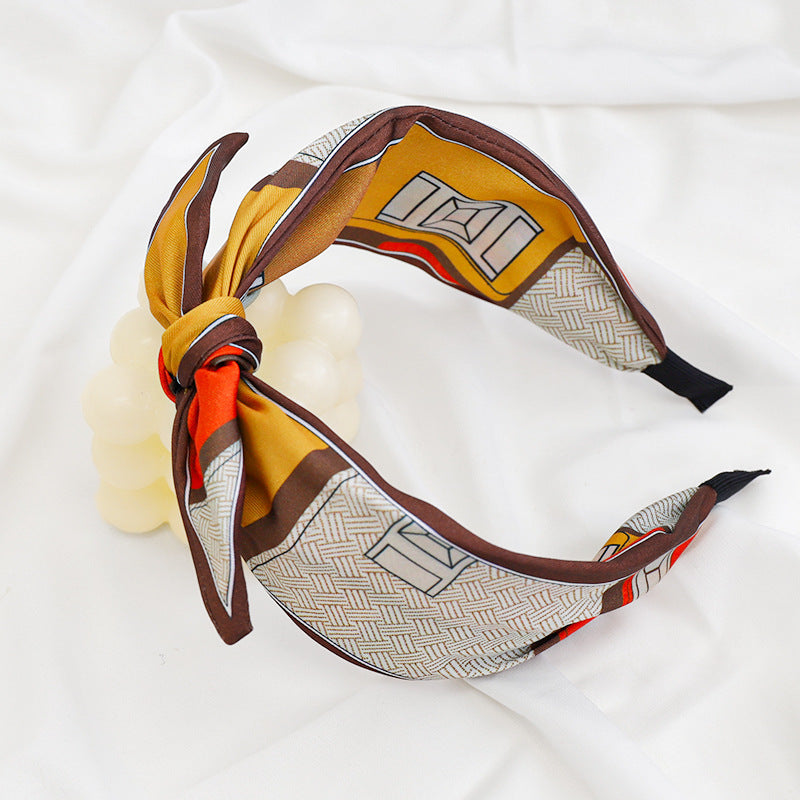 A Korean version of the new product headband fashion calico geometric wide edge headgear hair bundle go out bow hairpin