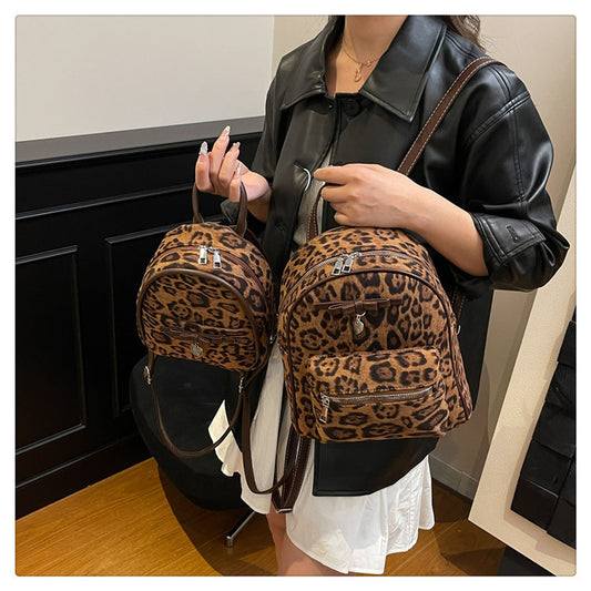 A flannel leopard print backpack