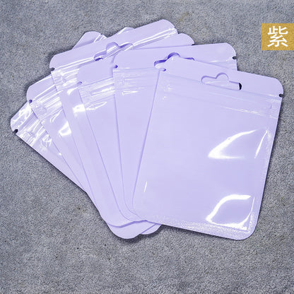 A Macaron color self-sealing bag, holographic bag, thickened transparent color bone bag, jewelry, sealed pocket, makeup brush, packaging bag.