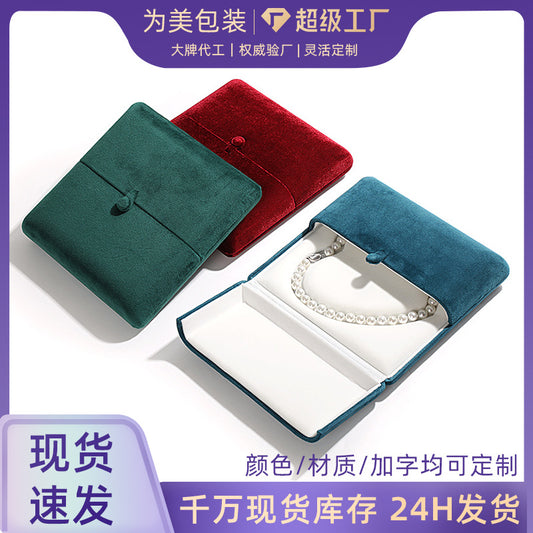 A heart shaped pearl necklace box