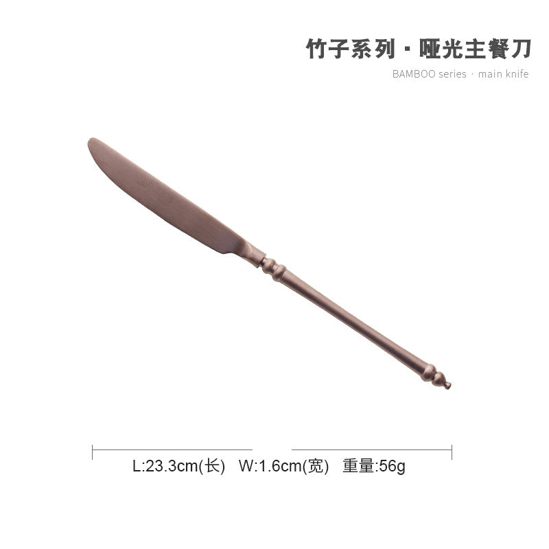 A stainless steel knife and fork set